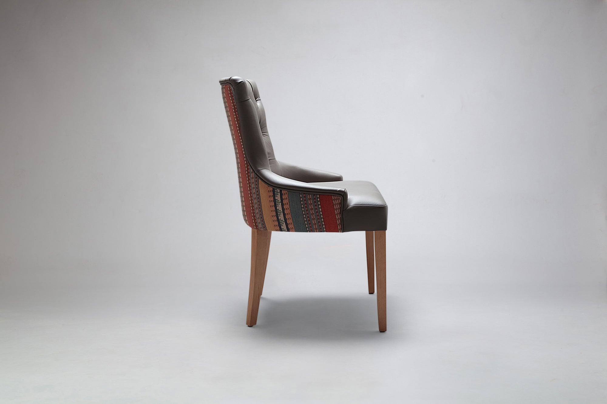 Apollo Button Back Dining Chair Side View in Combination Fabrics
