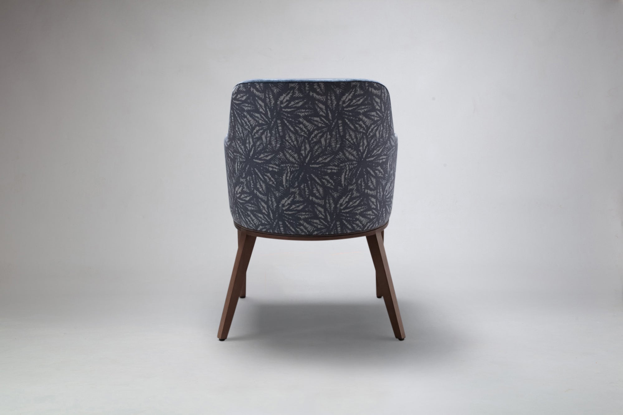 Rear View of Elroy Half Arm Carver Dining Chair In Patterned Fabric