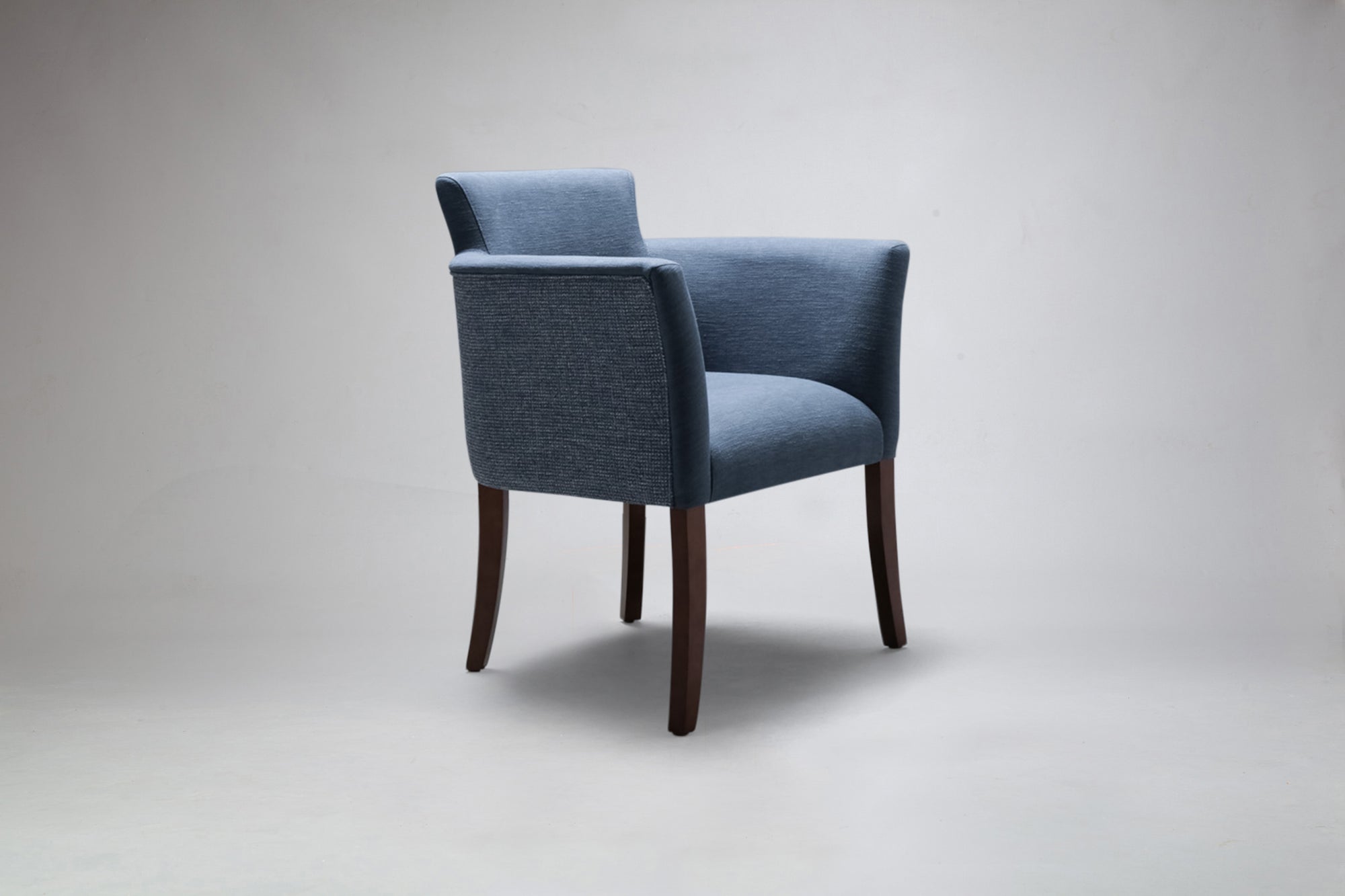 side view of hampton carver dining chair in two fabrics